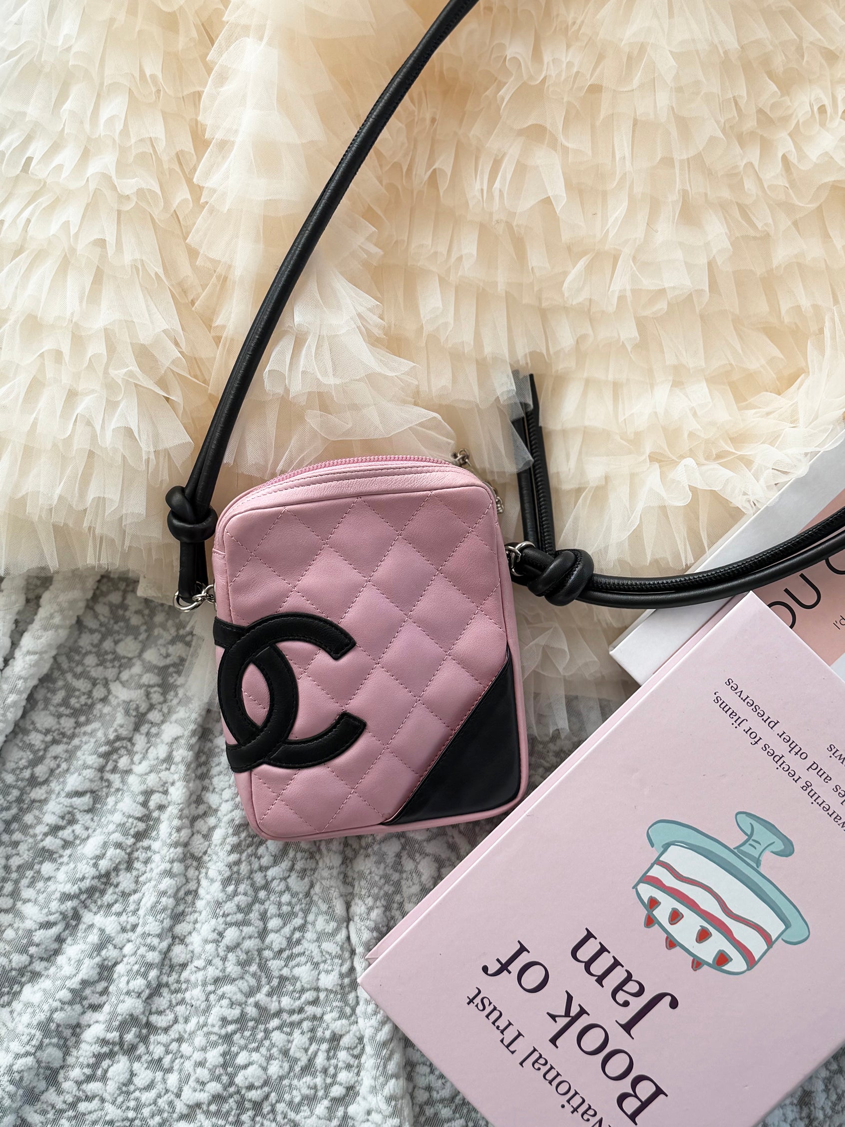 Chanel Pink Cambon Shoulder Bag can easily fit an iPhone Max
