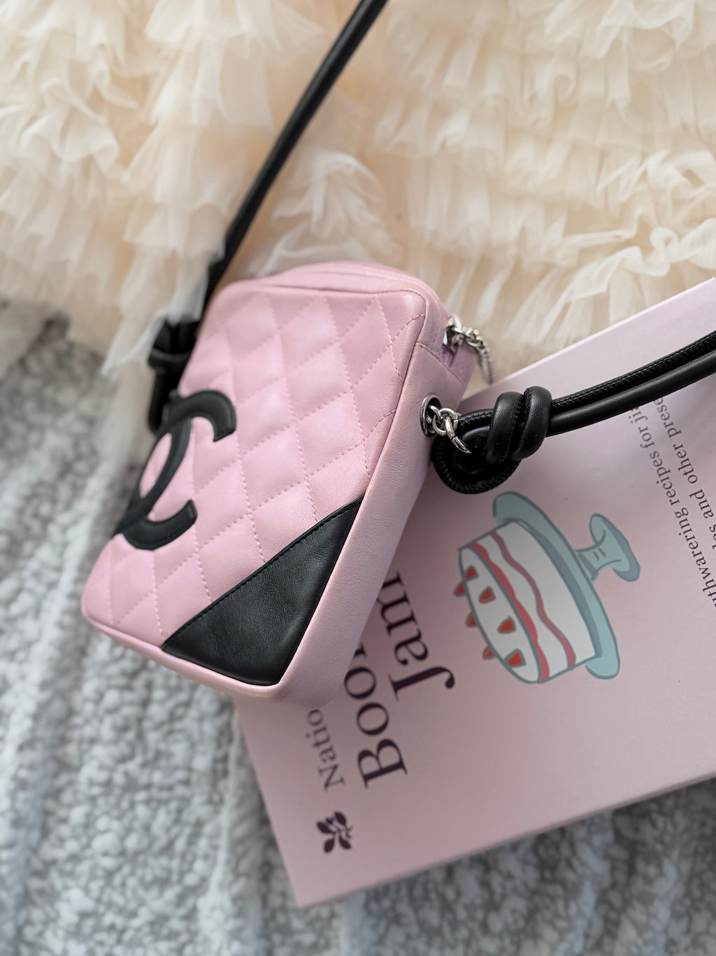 Chanel Pink Cambon Shoulder Bag can easily fit an iPhone Max