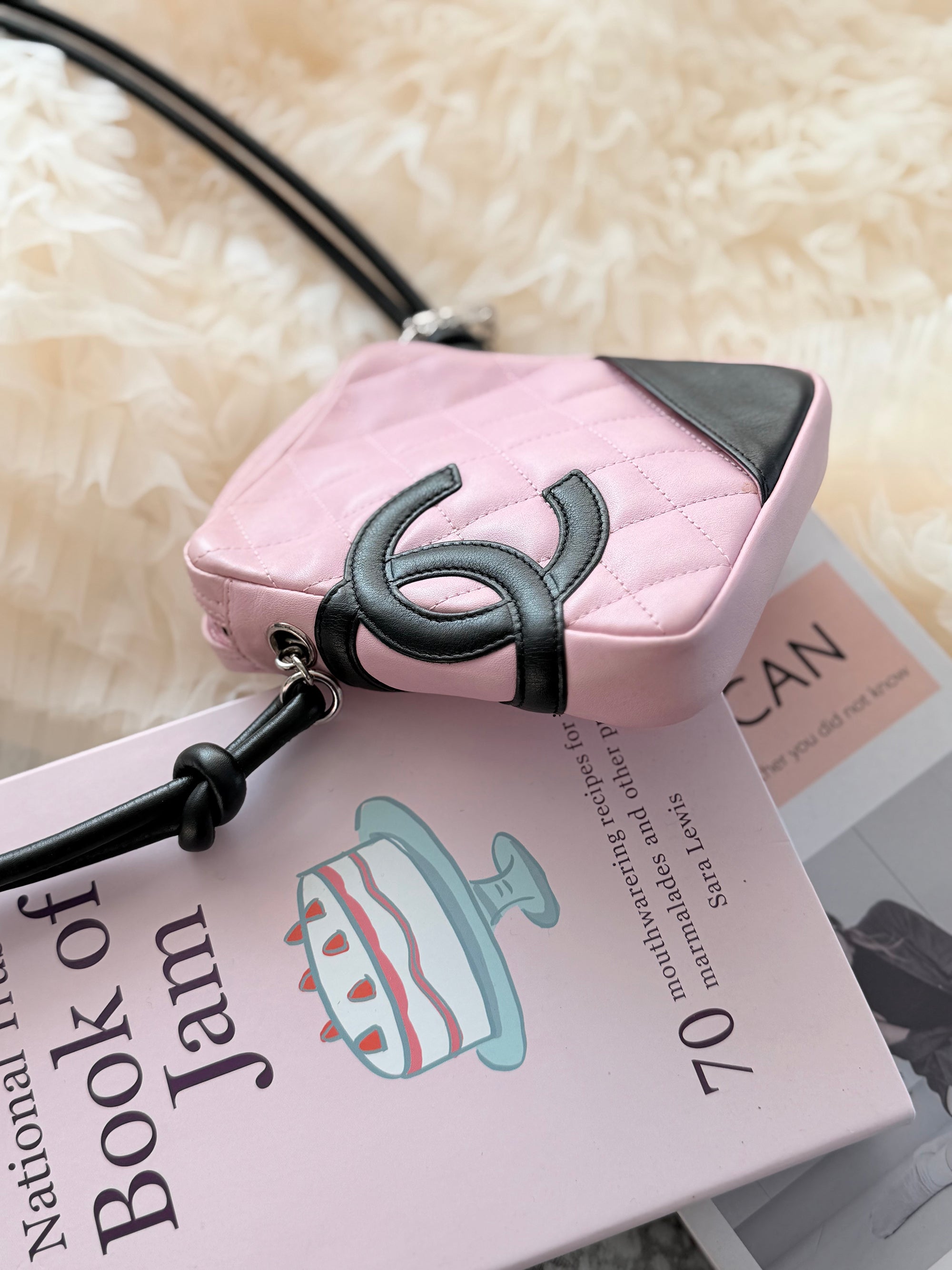 Chanel Pink Cambon Shoulder Bag can easily fit an iPhone Max