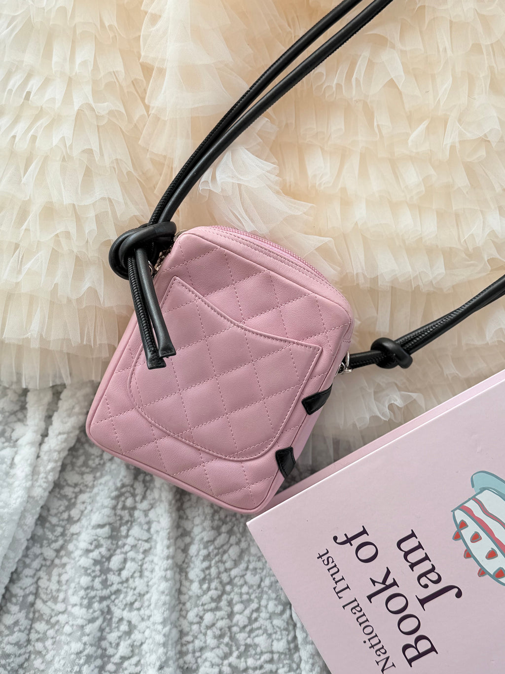 Chanel Pink Cambon Shoulder Bag can easily fit an iPhone Max
